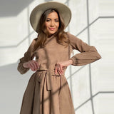 Mojoyce Casual O-Neck Belt Folds Knee Dress Autumn Long Sleeve Corduroy Loose Warm Office Lady A-Line Dresses For Women 2021